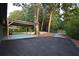 Spacious carport and parking area adjacent to the home, with potential for outdoor activities at 642 Austin Se Dr, Smyrna, GA 30082
