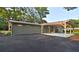 Spacious carport and parking area adjacent to the home, with potential for outdoor activities at 642 Austin Se Dr, Smyrna, GA 30082