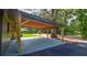 Spacious carport for parking and entertaining on a concrete platform with a backyard view at 642 Austin Se Dr, Smyrna, GA 30082