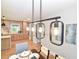 Chic dining room with decorative lighting fixture open to the gourmet kitchen at 642 Austin Se Dr, Smyrna, GA 30082