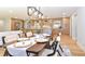 Open concept dining area featuring modern light fixture and seamlessly connected to kitchen at 642 Austin Se Dr, Smyrna, GA 30082