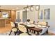 Elegant dining area featuring modern lighting and seamless flow to the kitchen at 642 Austin Se Dr, Smyrna, GA 30082