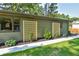 Exterior of home featuring a walkway with decorative flower beds and garden trellises at 642 Austin Se Dr, Smyrna, GA 30082