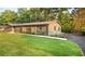 Beautifully landscaped lawn and garden leading to a well-maintained home and driveway at 642 Austin Se Dr, Smyrna, GA 30082