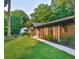 Charming house with manicured lawn, decorative trellises and freshly mulched flowerbeds at 642 Austin Se Dr, Smyrna, GA 30082