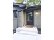 Close-up of a black front door with a wreath and a welcome mat at 642 Austin Se Dr, Smyrna, GA 30082