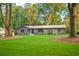 Charming one story home with green lawn and mature trees offering shade and curb appeal at 642 Austin Se Dr, Smyrna, GA 30082