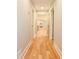 Hallway with hardwood flooring leading to a view of other rooms in the home at 642 Austin Se Dr, Smyrna, GA 30082
