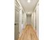 Hallway with hardwood flooring and painted doors and trim at 642 Austin Se Dr, Smyrna, GA 30082
