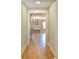 Hallway with hardwood floors leading to a bright room with natural light at 642 Austin Se Dr, Smyrna, GA 30082