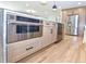 Kitchen island featuring stainless steel Forno microwave oven, drawers, and cabinets at 642 Austin Se Dr, Smyrna, GA 30082