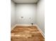 Clean laundry room offers beautiful hardwood flooring and convenient hook-ups at 642 Austin Se Dr, Smyrna, GA 30082