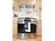 Stainless steel kitchen range with overhead vent hood at 642 Austin Se Dr, Smyrna, GA 30082