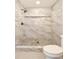 Shower showcasing marble-like tiles, a decorative floor and black shower fixture at 642 Austin Se Dr, Smyrna, GA 30082