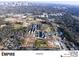 Aerial view of the Chosewood community showcasing new construction, green spaces, and city skyline in the distance at 1408 Cozy Court # 303, Atlanta, GA 30315