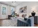 Bright living room with neutral tones, modern furniture, and natural light from large windows at 1408 Cozy Court # 303, Atlanta, GA 30315