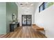 Bright lobby area with modern light fixtures, bench seating, console table and wood-look flooring at 1408 Cozy Court # 303, Atlanta, GA 30315