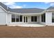 Spacious backyard with a concrete patio, ideal for entertaining at 325 Sassafras W Way, Holly Springs, GA 30115