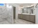 Luxurious bathroom with double vanity, marble counters, and a walk-in shower at 325 Sassafras W Way, Holly Springs, GA 30115