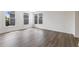 Well-lit bedroom with hardwood floors and large windows at 325 Sassafras W Way, Holly Springs, GA 30115