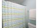 This bathroom offers a patterned shower curtain and white wall paint at 586 Devon Brooke Dr, Woodstock, GA 30188