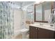 Well-maintained bathroom with shower, tub, and vanity for a relaxing experience at 586 Devon Brooke Dr, Woodstock, GA 30188