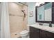 Modern bathroom featuring tiled shower and dark brown vanity at 586 Devon Brooke Dr, Woodstock, GA 30188