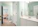 The light green bathroom leads to a bedroom at 586 Devon Brooke Dr, Woodstock, GA 30188