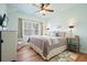 Relaxing bedroom with large window, comfortable bed and carpet at 586 Devon Brooke Dr, Woodstock, GA 30188