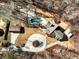 Aerial view showcasing the home with a circular driveway, pool, and outbuilding at 6734 Pass Road, Buford, GA 30518