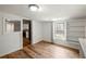 Light-filled bedroom with built in shelves and a glimpse into the kitchen at 6734 Pass Road, Buford, GA 30518