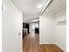 Hallway with a glimpse into the kitchen at 6734 Pass Road, Buford, GA 30518