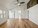 Spacious living room with wood floors, shiplap walls, and a vaulted ceiling at 6734 Pass Road, Buford, GA 30518