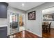 A dining area features hardwood floors, gray walls, and artwork at 2583 Bronco Trl, Duluth, GA 30096