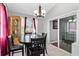 Dining room features a dark wood table and decorative hutch with access to a sliding door at 2583 Bronco Trl, Duluth, GA 30096