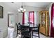 Cozy dining area with a round table, dark wood chairs, and natural light from a window at 2583 Bronco Trl, Duluth, GA 30096