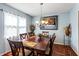 Elegant dining room with hardwood floors, a chandelier, and a classic wooden table at 2583 Bronco Trl, Duluth, GA 30096