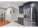 Beautiful kitchen design with stainless steel refrigerator, modern grey cabinets, and ample storage at 2583 Bronco Trl, Duluth, GA 30096