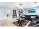 Bright living room with tile flooring, a comfortable sectional sofa, and a decorative rug at 2583 Bronco Trl, Duluth, GA 30096