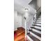 A staircase with wooden steps and white railings leads to the upper level at 2583 Bronco Trl, Duluth, GA 30096