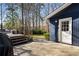 A charming backyard with a deck, leading to a well-maintained lawn and a backdrop of mature trees at 2858 Skyland Ne Dr, Brookhaven, GA 30341