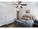 Bright bedroom with an antique-style brass bed frame, dark wood floors and crisp white walls at 2858 Skyland Ne Dr, Brookhaven, GA 30341