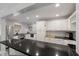 Modern kitchen featuring stainless steel appliances, black countertops, and white cabinetry at 2858 Skyland Ne Dr, Brookhaven, GA 30341