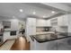 Bright kitchen with stainless steel appliances, black countertops, and white cabinets at 2858 Skyland Ne Dr, Brookhaven, GA 30341