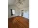 Bedroom boasts wood floors and natural light, with laundry closet at 4622 Dogwood Rd, Pine Lake, GA 30083