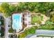 Aerial view of a complex featuring a community pool, grilling area, playground, parking and manicured green spaces at 795 Hammond Dr # 801, Atlanta, GA 30328