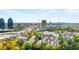 Scenic aerial view of the neighborhood's high-rise apartments surrounded by lush, mature trees and greenery at 795 Hammond Dr # 801, Atlanta, GA 30328