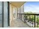 Condo balcony featuring railing, door, and view of parking lot at 795 Hammond Dr # 801, Atlanta, GA 30328