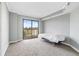 Bedroom with a sliding glass door leading to a balcony with a view of the city at 795 Hammond Dr # 801, Atlanta, GA 30328