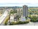 Scenic view of residential towers with tree coverage alongside a bustling highway at 795 Hammond Dr # 801, Atlanta, GA 30328